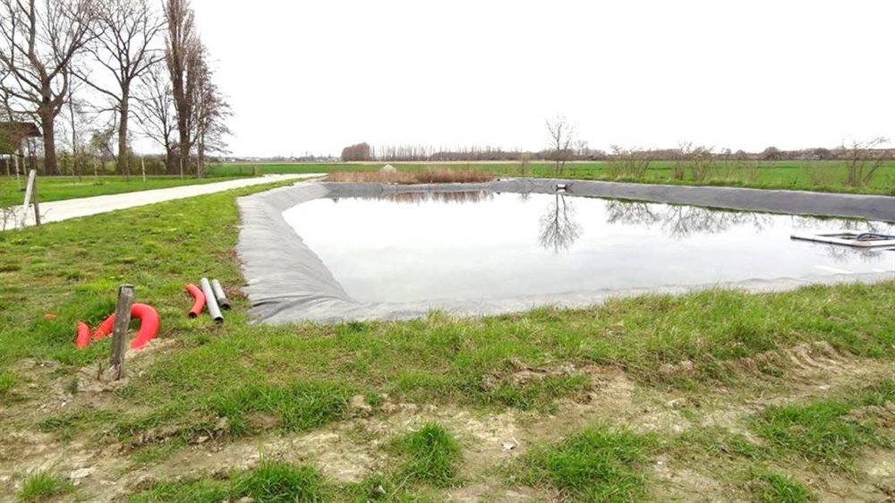 Wateropslag die niet boven het maaiveld uitkomt.